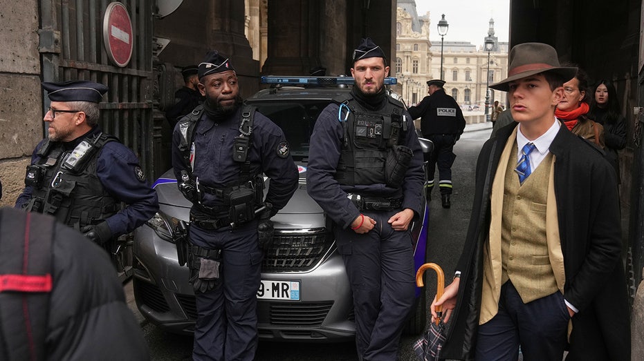 mystery-man-in-dapper-suit-goes-viral-after-appearing-in-louvre-heist-investigation-photo