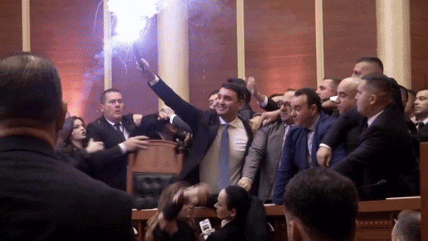 albanian-opposition-lawmakers-light-flares,-scuffle-with-police-amid-parliament-chaos-over-corruption-probe